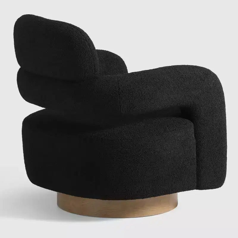 Fauteuil pivotant rond effet peau de mouton d'inspiration Mid-Century Modern