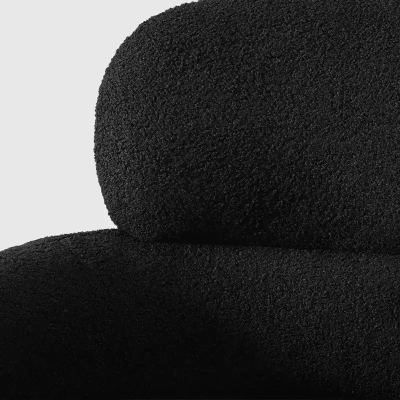 Fauteuil pivotant rond effet peau de mouton d'inspiration Mid-Century Modern