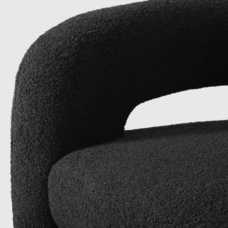 Fauteuil pivotant rond effet peau de mouton d'inspiration Mid-Century Modern