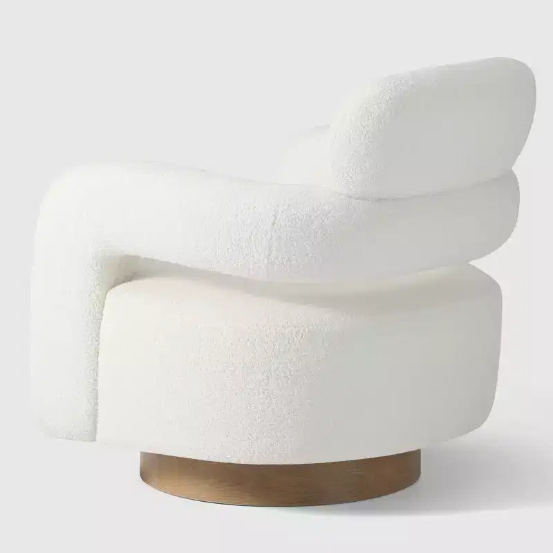 Fauteuil pivotant rond effet peau de mouton d'inspiration Mid-Century Modern