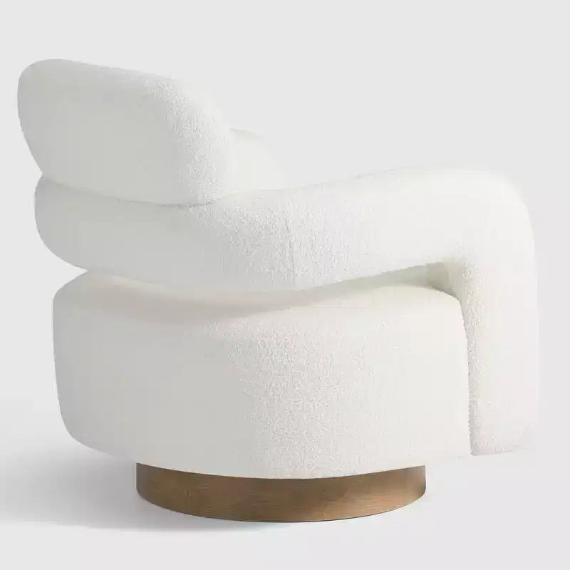 Fauteuil pivotant rond effet peau de mouton d'inspiration Mid-Century Modern