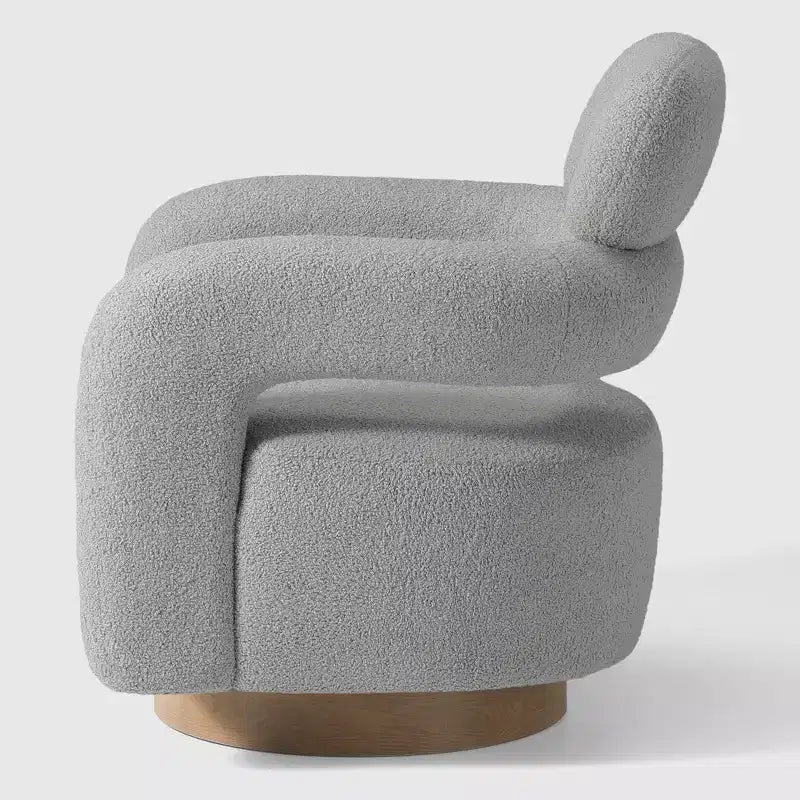 Fauteuil pivotant rond effet peau de mouton d'inspiration Mid-Century Modern