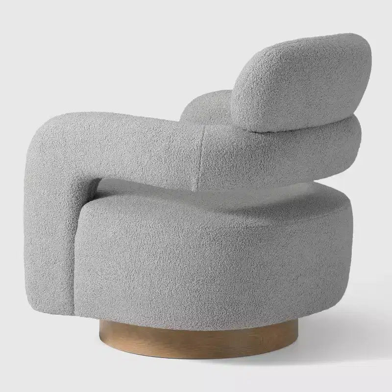 Fauteuil pivotant rond effet peau de mouton d'inspiration Mid-Century Modern