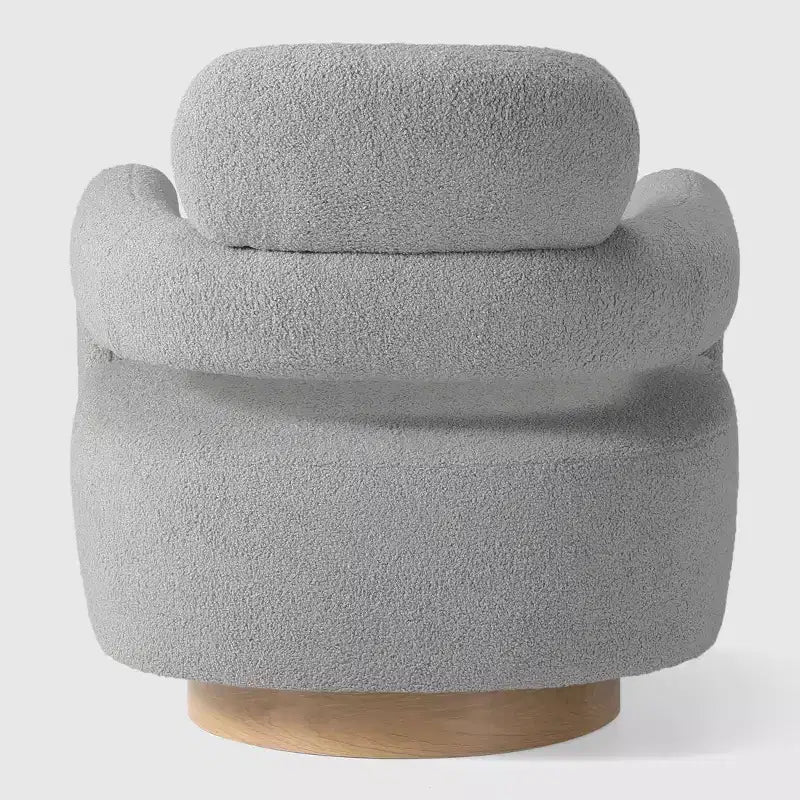 Fauteuil pivotant rond effet peau de mouton d'inspiration Mid-Century Modern