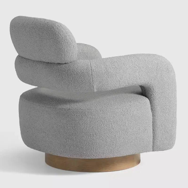 Fauteuil pivotant rond effet peau de mouton d'inspiration Mid-Century Modern