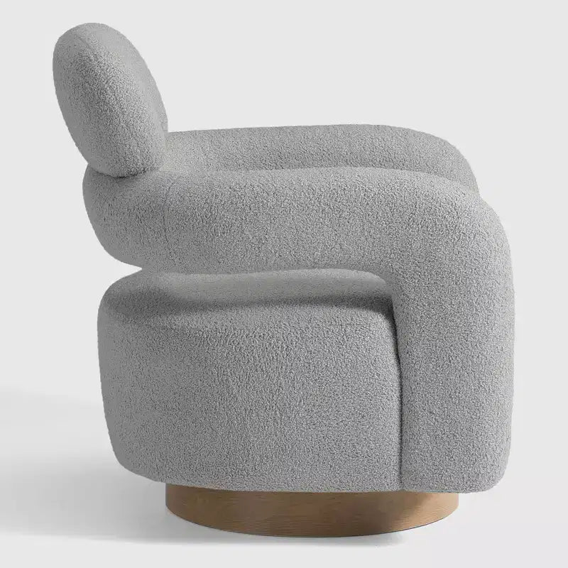 Fauteuil pivotant rond effet peau de mouton d'inspiration Mid-Century Modern