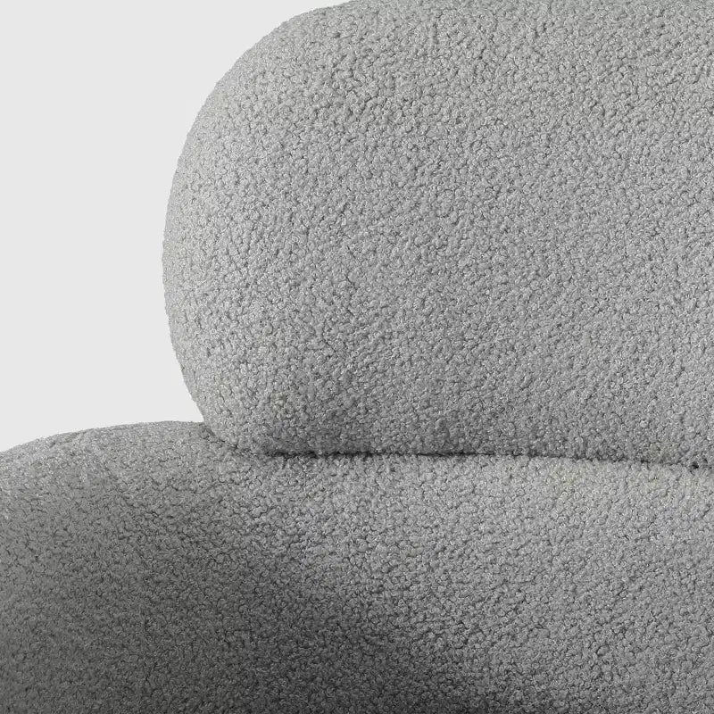 Fauteuil pivotant rond effet peau de mouton d'inspiration Mid-Century Modern