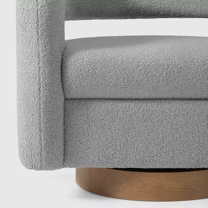 Fauteuil pivotant rond effet peau de mouton d'inspiration Mid-Century Modern