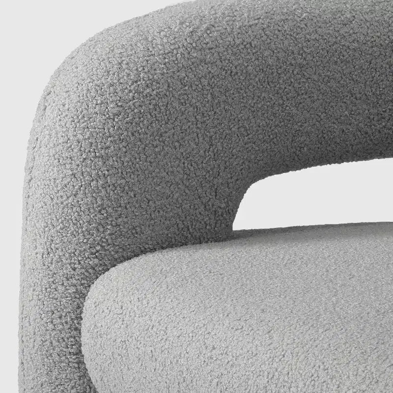 Fauteuil pivotant rond effet peau de mouton d'inspiration Mid-Century Modern