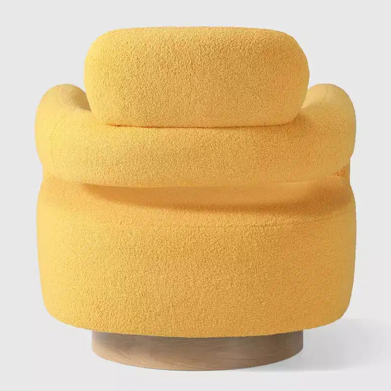 Fauteuil pivotant rond effet peau de mouton d'inspiration Mid-Century Modern