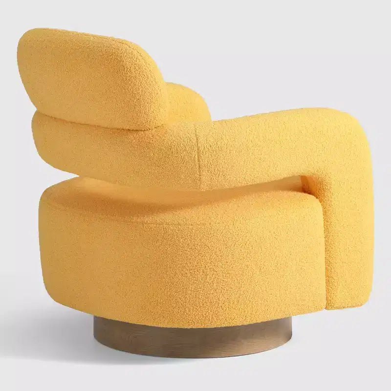 Fauteuil pivotant rond effet peau de mouton d'inspiration Mid-Century Modern