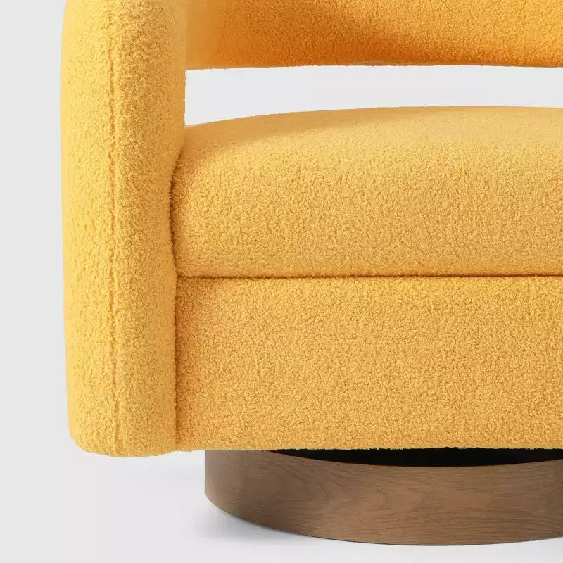 Fauteuil pivotant rond effet peau de mouton d'inspiration Mid-Century Modern