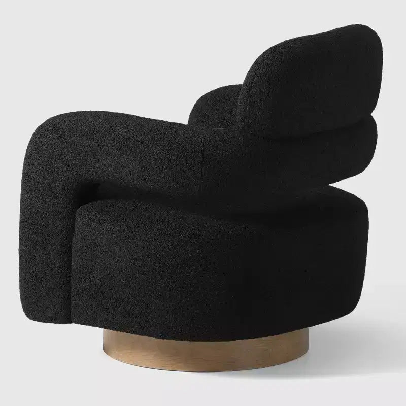 Fauteuil pivotant rond effet peau de mouton d'inspiration Mid-Century Modern