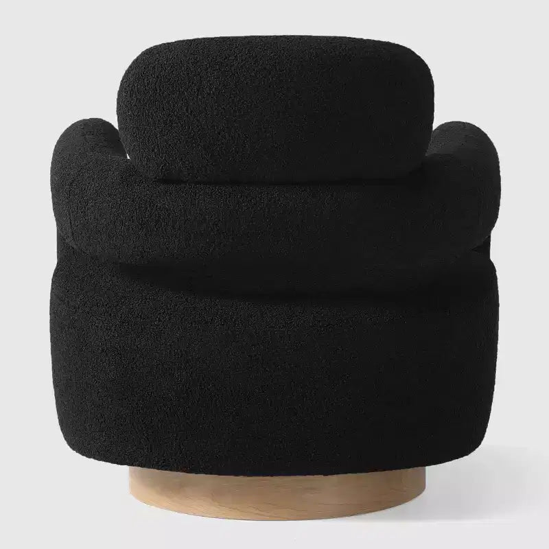 Fauteuil pivotant rond effet peau de mouton d'inspiration Mid-Century Modern